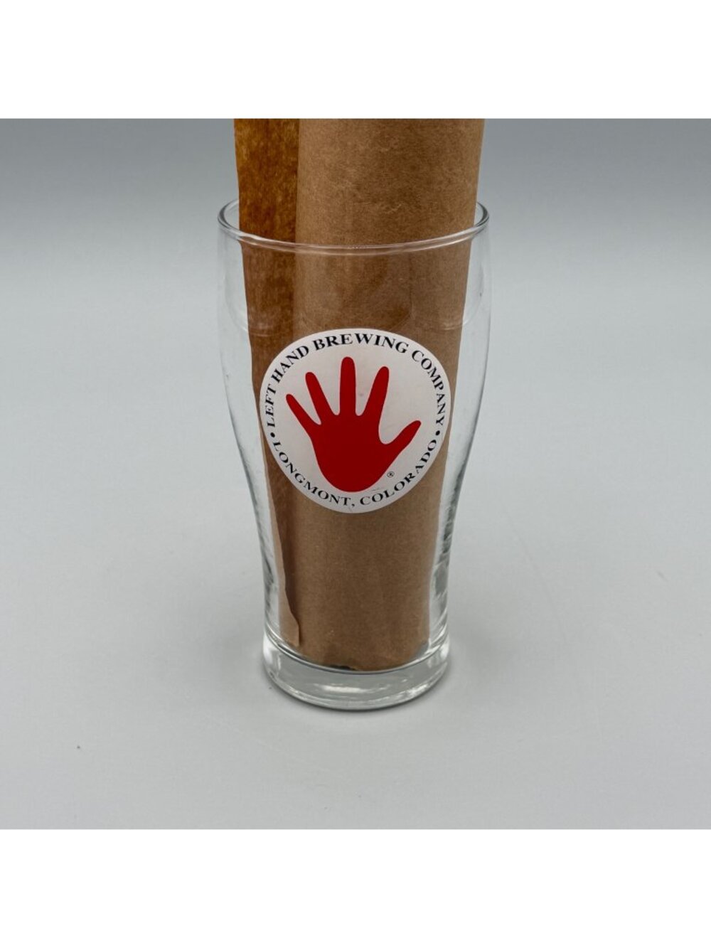 Left Hand Brewing Company Logo Pint Glass 16oz With Red Hand & Text Design